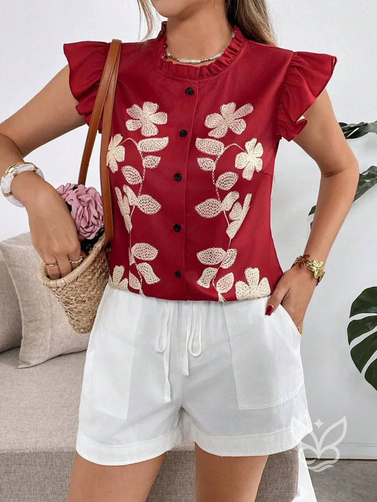 Blusa Bordada Floral Com Babados E Botões Frontais Blusa Bordada Floral Com Babados E Botões Frontais