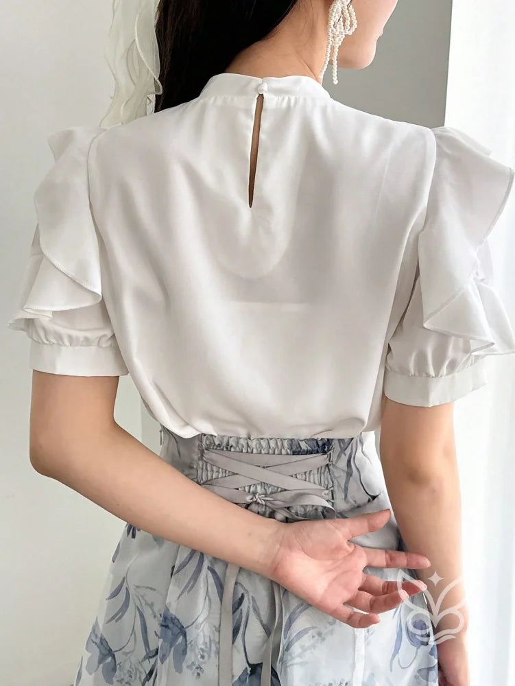 Blusa Com Babados E Laço Na Gola De Caimento Sofisticado Blusa Com Babados E Laço Na Gola De Caimento Sofisticado