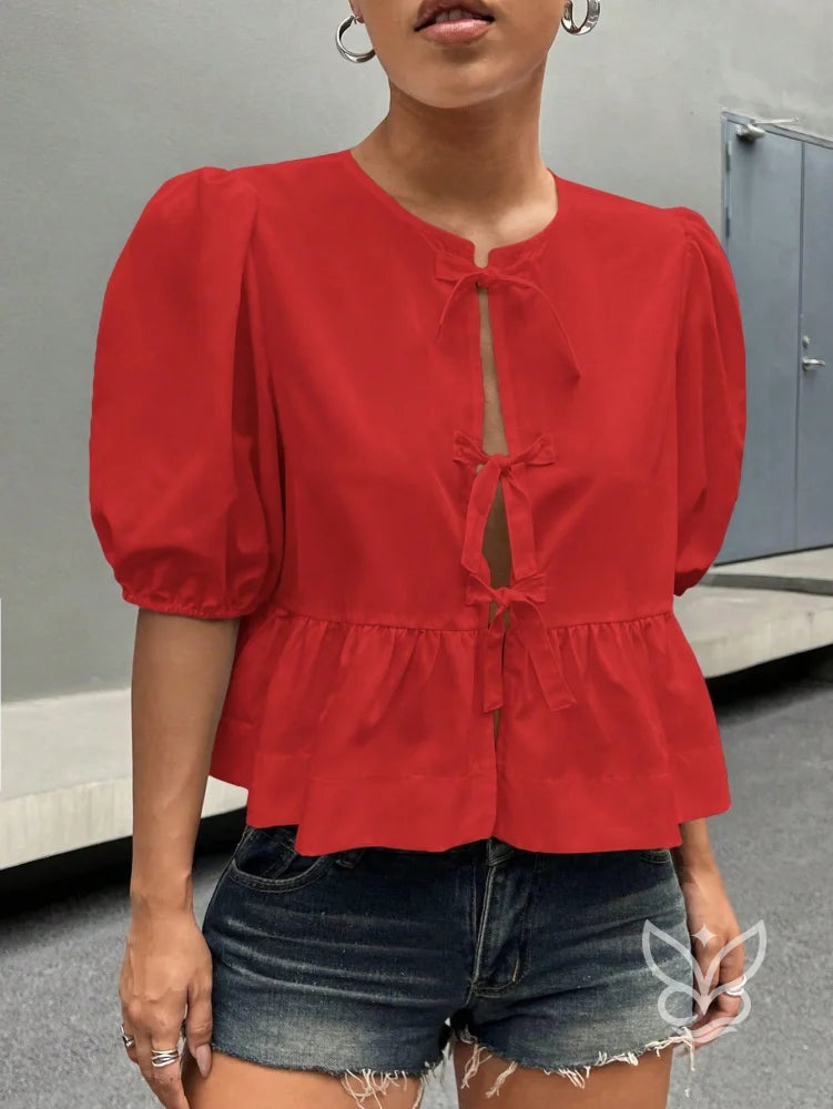 Blusa com Laços Delicados e Manga Bufante Estruturada Blusa com Laços Delicados e Manga Bufante Estruturada