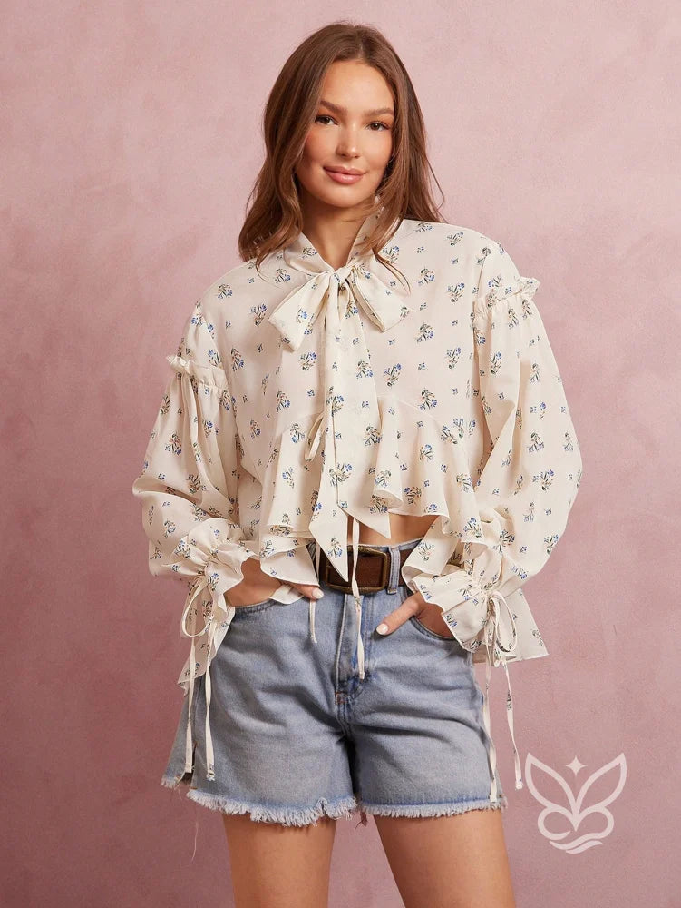 Blusa Floral Com Manga Bufante E Amarração Na Gola Blusa Floral Com Manga Bufante E Amarração Na Gola