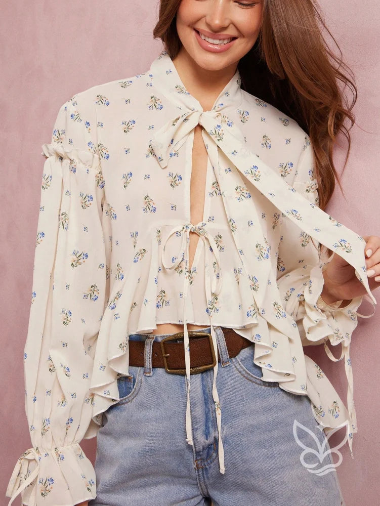 Blusa Floral Com Manga Bufante E Amarração Na Gola Blusa Floral Com Manga Bufante E Amarração Na Gola