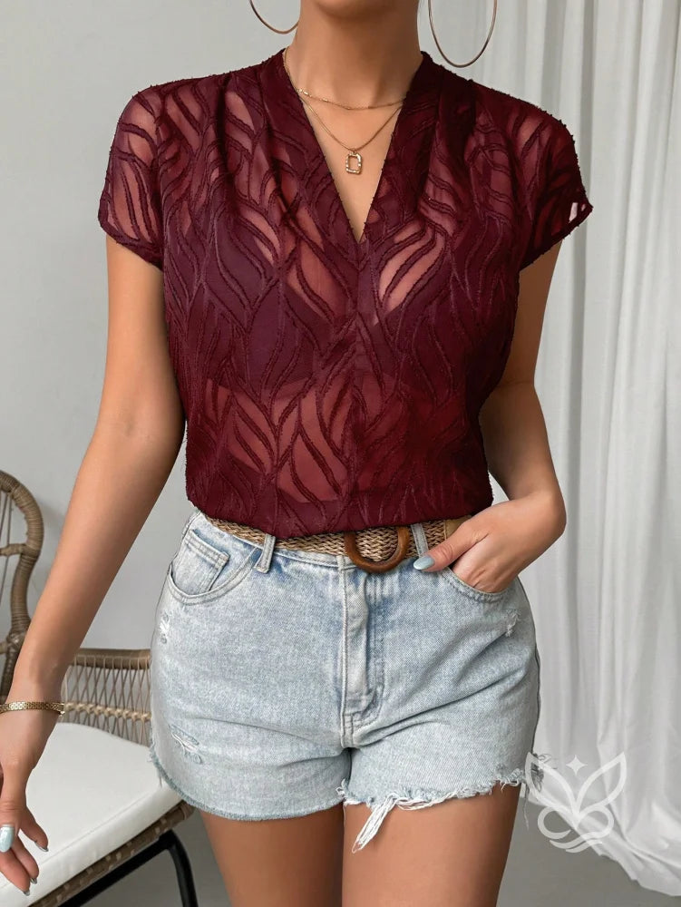 Blusa Jacquard Decote V Com Manga Curta E Caimento Sofisticado Blusa Jacquard Decote V Com Manga Curta E Caimento