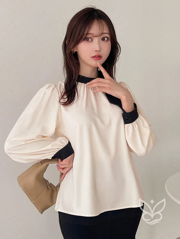 Blusa Manga Bufante Com Gola Alta E Punho Contrastante Blusa Manga Bufante Com Gola Alta E Punho Contrastante