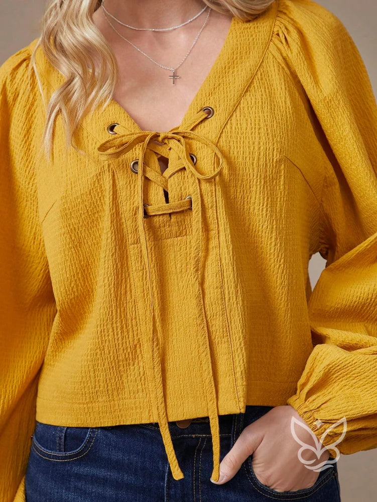 Blusa Manga Longa Em Algodão Com Decote Com Amarração Blusa Manga Longa Em Algodão Com Decote Com Amarração