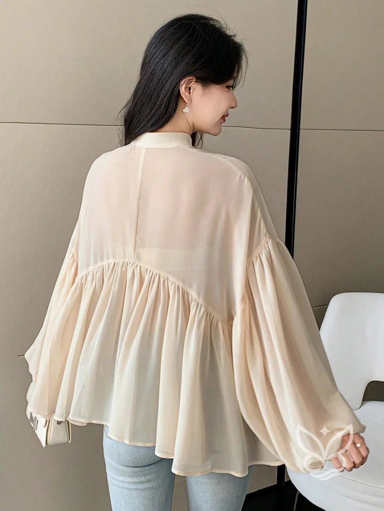Blusa Plissada Com Gola Alta E Manga Longa Blusa Plissada Com Gola Alta E Manga Longa