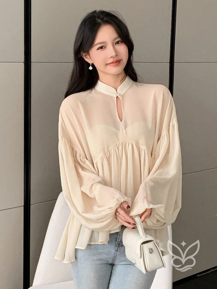 Blusa Plissada Com Gola Alta E Manga Longa Blusa Plissada Com Gola Alta E Manga Longa