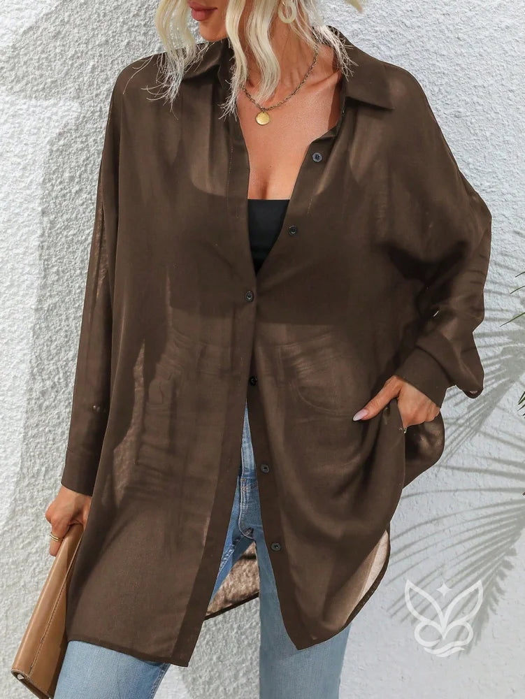 Blusa Botões Frontais Com Manga Drop Shoulder e Manga Longa Blusa Botões Frontais Com Manga Drop Shoulder e Manga Longa