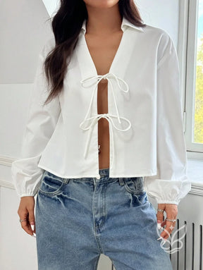 Blusa com Amarração Frontal e Manga Longa Bufante Blusa com Amarração Frontal e Manga Longa Bufante