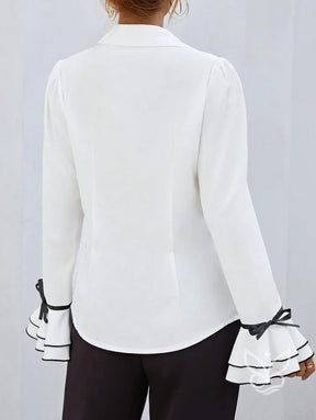 Blusa Com Manga Flare Babados E Contorno Contrastante Blusa Com Manga Flare Babados E Contorno Contrastante