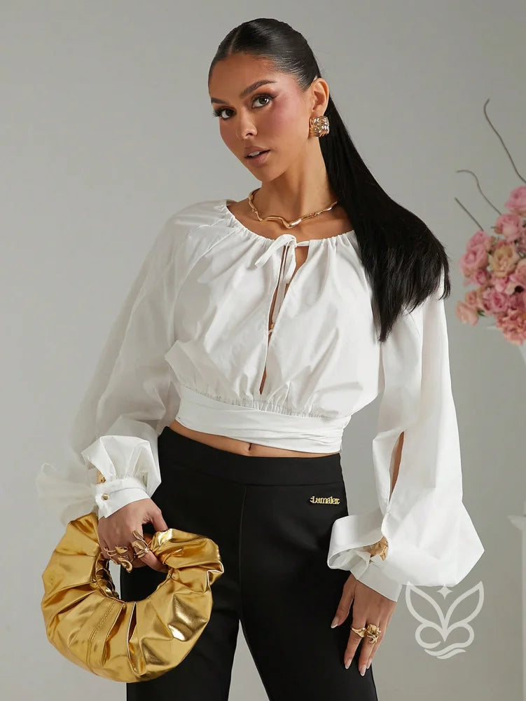 Blusa Cropped Manga Longa Amarração No Decote E Punho Bufante Blusa Cropped Manga Longa Amarração No Decote E Punho
