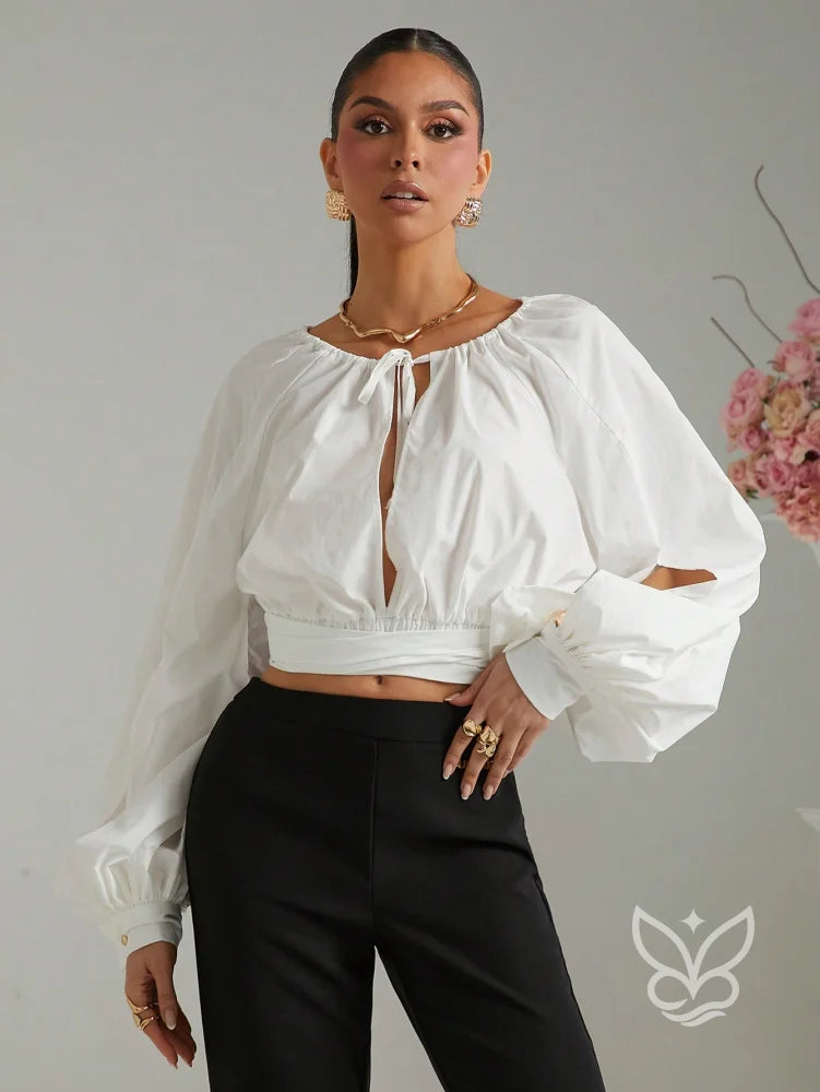 Blusa Cropped Manga Longa Amarração No Decote E Punho Bufante Blusa Cropped Manga Longa Amarração No Decote E Punho