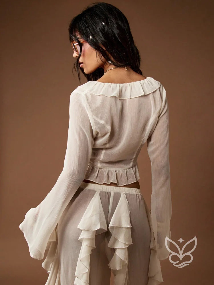 Blusa Cropped Manga Longa Com Babados E Amarração Frontal Blusa Cropped Manga Longa Com Babados E Amarração Frontal
