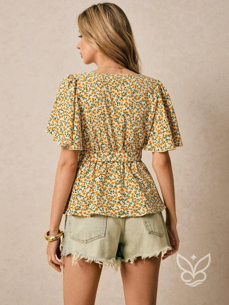 Blusa Estampada Floral com Decote V e Amarração Peplum Blusa Estampada Floral com Decote V e Amarração Peplum