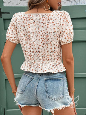 Blusa Floral Com Decote Coração E Lastex Na Cintura Blusa Floral Com Decote Coração E Lastex Na Cintura