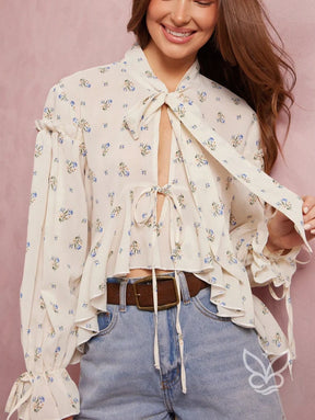 Blusa Floral Com Manga Bufante E Amarração Na Gola Blusa Floral Com Manga Bufante E Amarração Na Gola