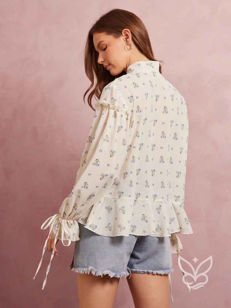Blusa Floral Com Manga Bufante E Amarração Na Gola Blusa Floral Com Manga Bufante E Amarração Na Gola