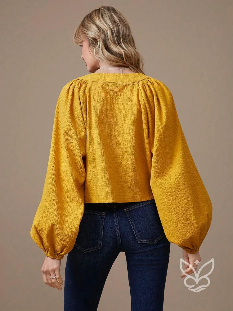 Blusa Manga Longa Em Algodão Com Decote Com Amarração Blusa Manga Longa Em Algodão Com Decote Com Amarração