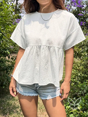 Blusa Peplum com Caimento Solto e Gola Redonda Blusa Peplum com Caimento Solto e Gola Redonda