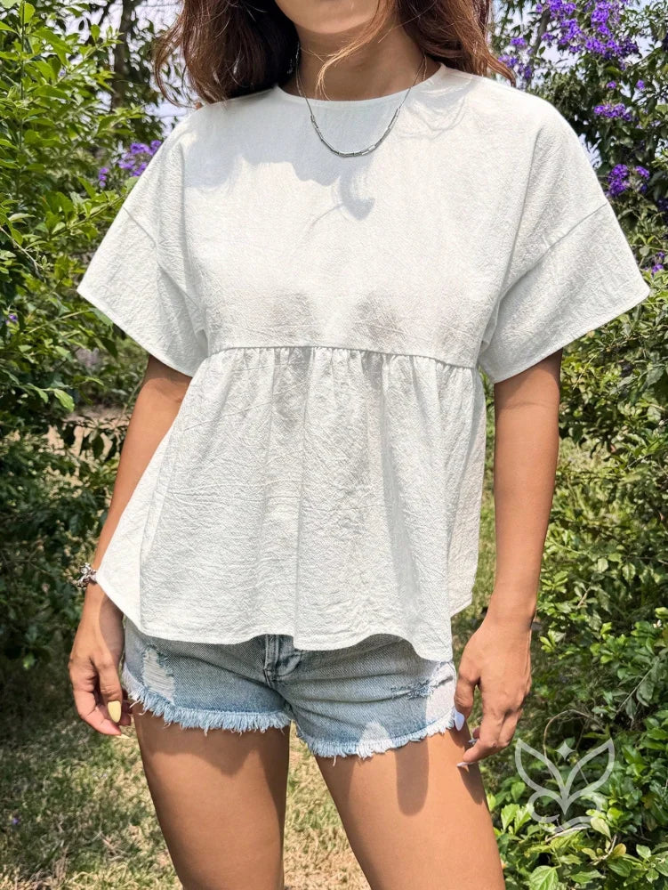 Blusa Peplum com Caimento Solto e Gola Redonda Blusa Peplum com Caimento Solto e Gola Redonda