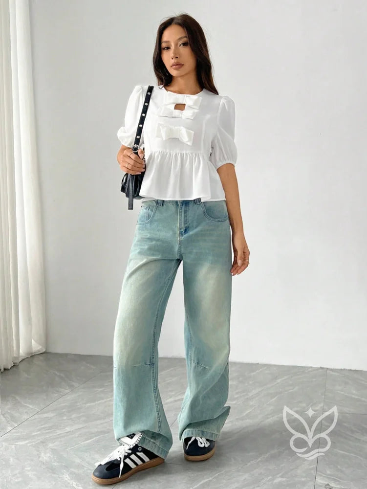 Blusa Peplum com Laços Frontais e Manga Bufante Blusa Peplum com Laços Frontais e Manga Bufante