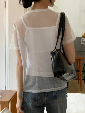 Blusa Tule Com Gola Redonda Manga Curta E Caimento Leve Blusa Tule Com Gola Redonda Manga Curta E Caimento Leve