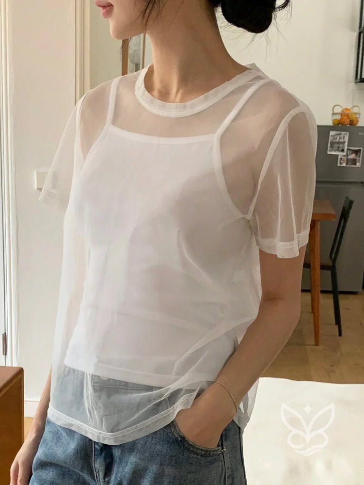 Blusa Tule Com Gola Redonda Manga Curta E Caimento Leve Blusa Tule Com Gola Redonda Manga Curta E Caimento Leve