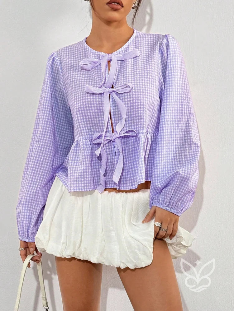 Blusa Xadrez com Laços Frontais e Barra Peplum Charmosa Blusa Xadrez com Laços Frontais e Barra Peplum Charmosa