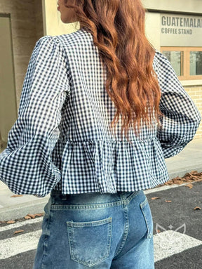Blusa Xadrez com Laços Frontais e Barra Peplum Charmosa Blusa Xadrez com Laços Frontais e Barra Peplum Charmosa