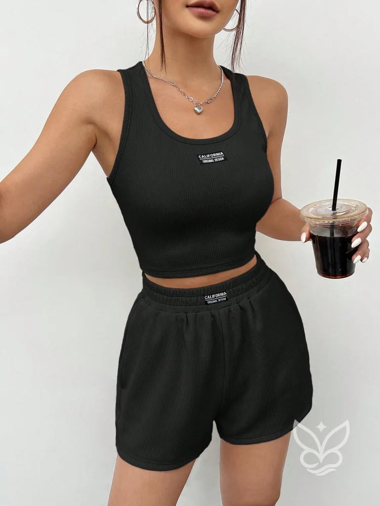 Conjunto Athleisure Com Regata Canelada E Shorts Com Cós Elástico Preto / PP Conjunto Athleisure Com Regata Canelada E