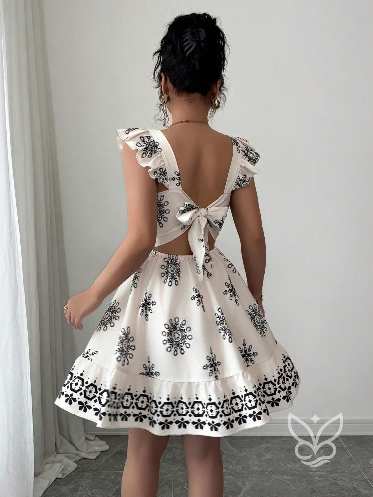 Vestido Curto Com Amarração Nas Costas E Mangas Fluídas Vestido Curto Com Amarração Nas Costas E Mangas Fluídas