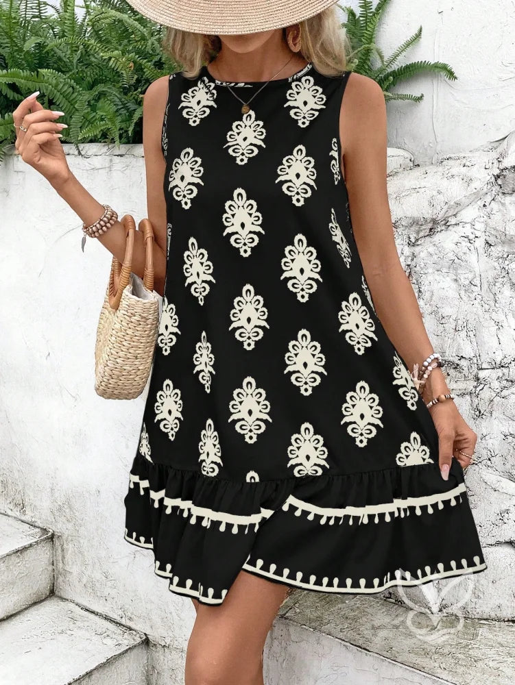 Vestido Curto Soltinho Com Estampa E Laço Nas Costas Vestido Curto Soltinho Com Estampa E Laço Nas Costas