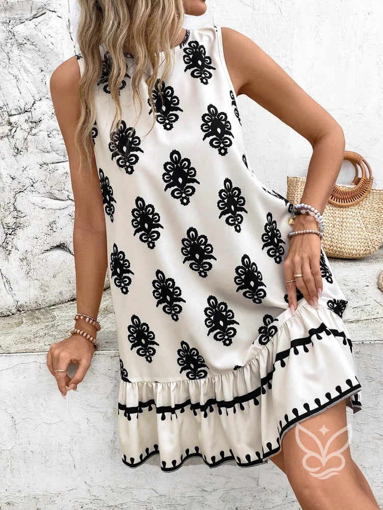 Vestido Curto Soltinho Com Estampa E Laço Nas Costas Vestido Curto Soltinho Com Estampa E Laço Nas Costas
