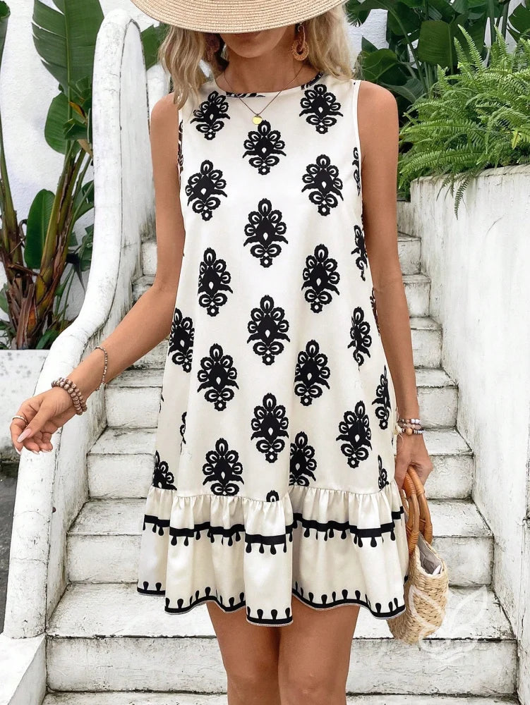 Vestido Curto Soltinho Com Estampa E Laço Nas Costas Vestido Curto Soltinho Com Estampa E Laço Nas Costas