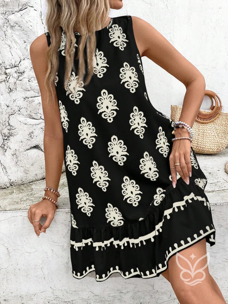 Vestido Curto Soltinho Com Estampa E Laço Nas Costas Vestido Curto Soltinho Com Estampa E Laço Nas Costas