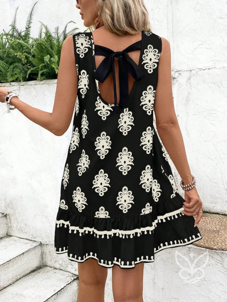 Vestido Curto Soltinho Com Estampa E Laço Nas Costas Preto / PP Vestido Curto Soltinho Com Estampa E Laço Nas Costas