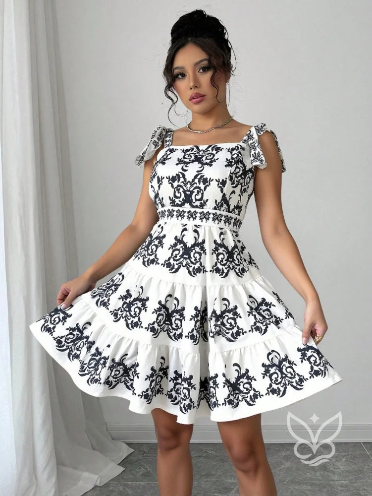 Vestido Rodado Com Alça Laço E Bordado Floral Contrastante Vestido Rodado Com Alça Laço E Bordado Floral Contrastante